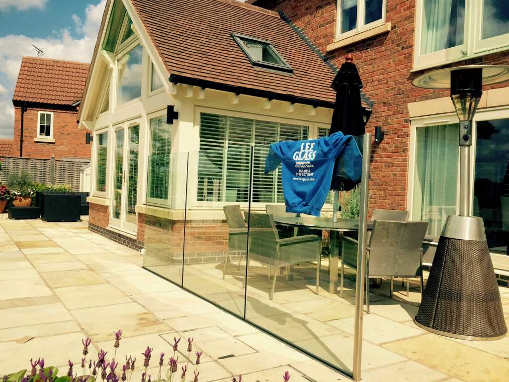 12mm Clear toughened glass wind break using a structural channel.