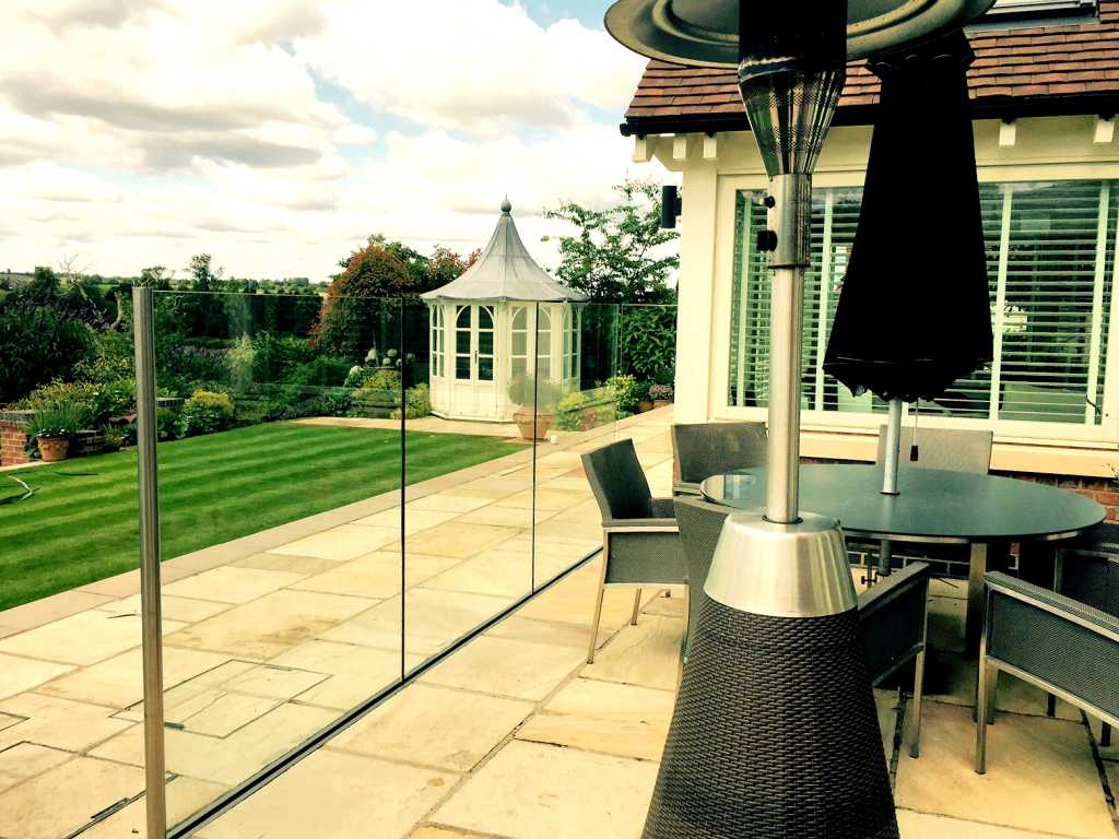 12mm Clear toughened glass wind break using a structural channel.
