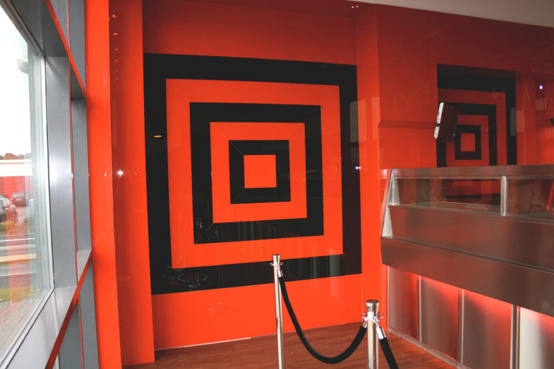 Glass splashbacks needn't be confined to the kitchen, as this innovative chip shop in Leicester has proven by using these to decorate their customer order area!