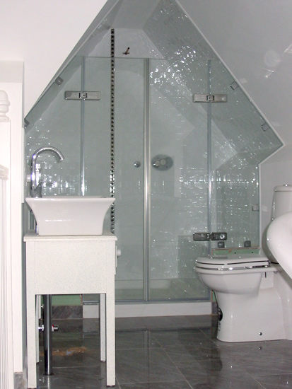 Awkward angles and shapes needn't be a problem! For bathrooms of a more unique nature we simply make MDF templates on site which enable us to replicate the glass exactly as required as part of our bespoke supply and fit service.