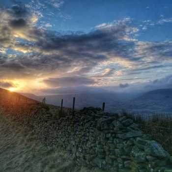 Sunset over Mam Tor after a long day hiking