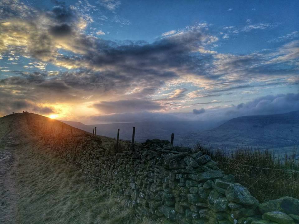Sunset over Mam Tor after a long day hiking