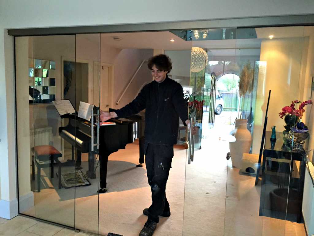 person opening glass doors