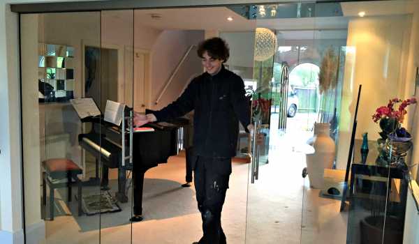 person opening glass doors
