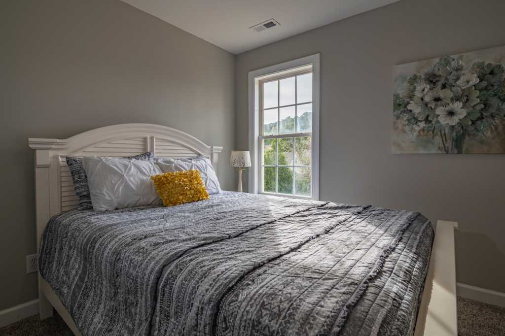 double glazed window in bedroom with large double bed